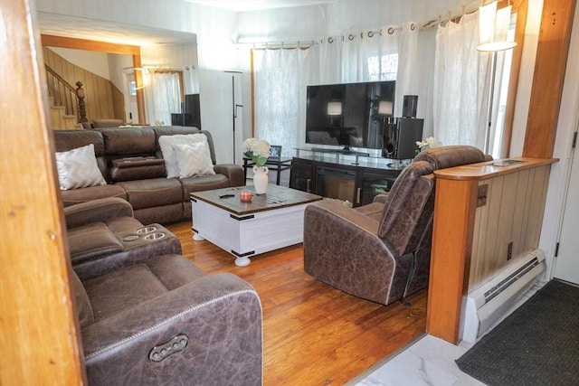 82 Jefferson Ave, Everett, MA 02149 - living area with stairway and a baseboard radiator