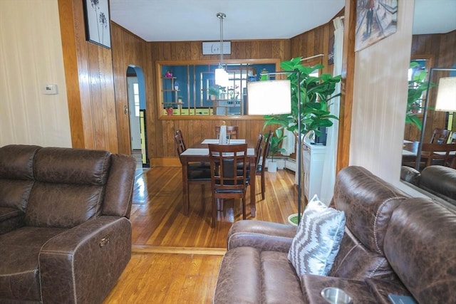 82 Jefferson Ave, Everett, MA 02149 - living area with wood walls, arched walkways, and hardwood / wood-style flooring
