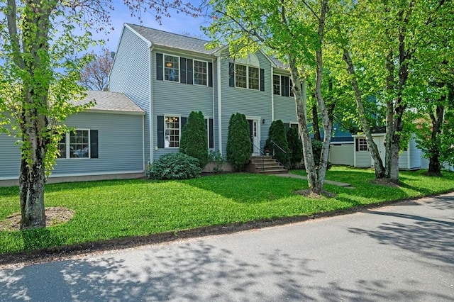 26 Harvest Rd, Reading, MA 01867 - view of front facade with a front lawn