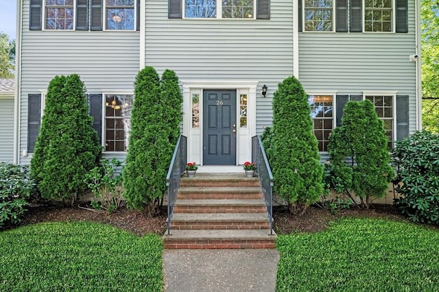 26 Harvest Rd, Reading, MA 01867 - doorway to property with a lawn