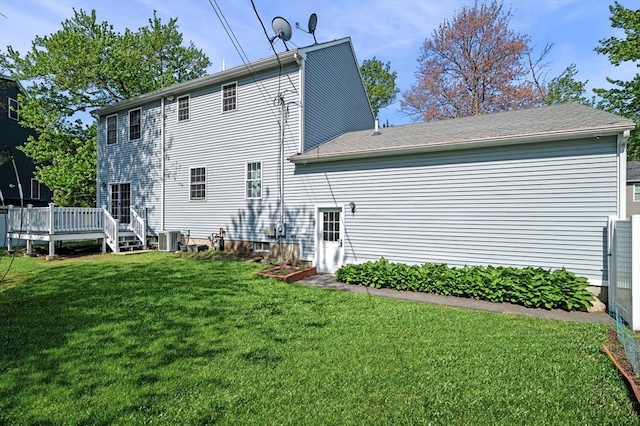 26 Harvest Rd, Reading, MA 01867 - rear view of property with a wooden deck and a lawn
