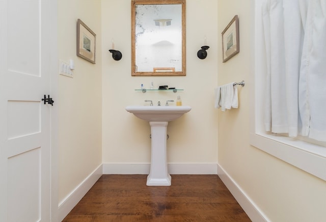 bathroom with hardwood / wood-style flooring