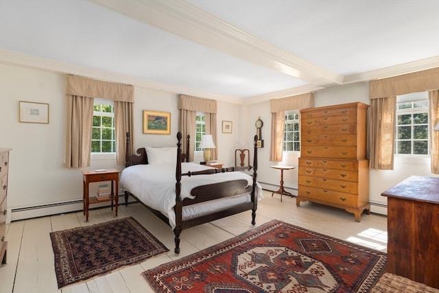 bedroom with a baseboard heating unit, light hardwood / wood-style flooring, and beam ceiling