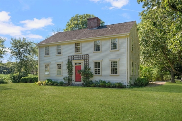 colonial home with a front yard