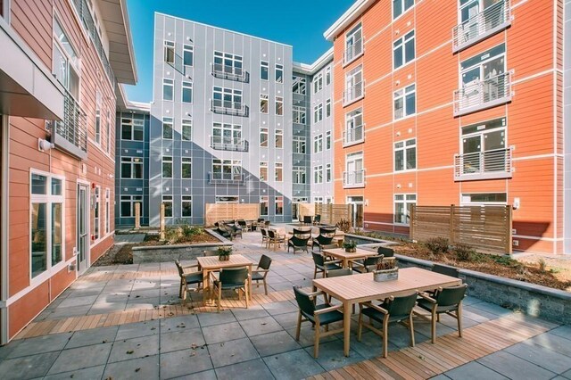view of home's community with outdoor dining area