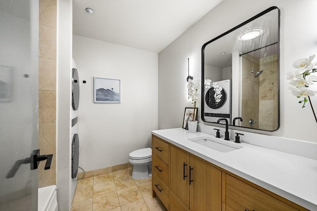 1313 Washington St Unit 309, Boston, MA 02118 - bathroom featuring stacked washer and clothes dryer, a shower, and vanity