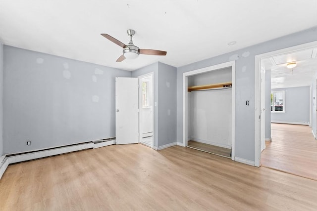 59 Harvard St, Everett, MA 02149 - unfurnished bedroom featuring attic access, light wood-style flooring, baseboards, a closet, and a ceiling fan