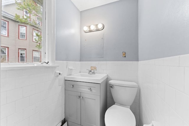 59 Harvard St, Everett, MA 02149 - bathroom featuring tile walls, toilet, a wainscoted wall, and vanity