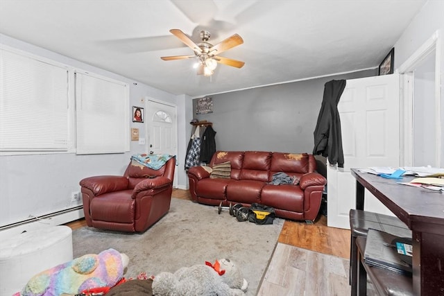 59 Harvard St, Everett, MA 02149 - living room with wood finished floors, a baseboard radiator, and ceiling fan