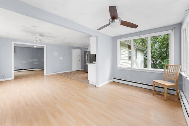 59 Harvard St, Everett, MA 02149 - unfurnished living room with a ceiling fan, light wood finished floors, and baseboard heating