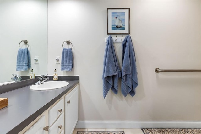 bathroom featuring vanity and baseboards