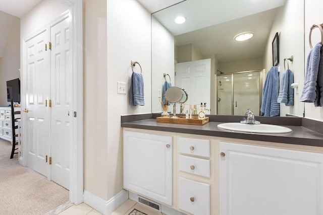 bathroom with visible vents, a shower stall, baseboards, recessed lighting, and vanity