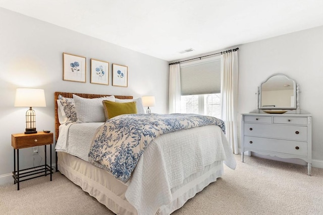 carpeted bedroom featuring baseboards