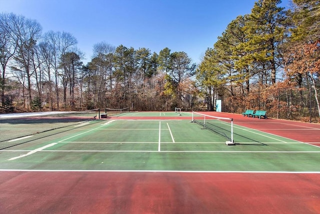 view of sport court featuring community basketball court and fence