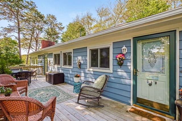 wooden deck featuring outdoor dining space