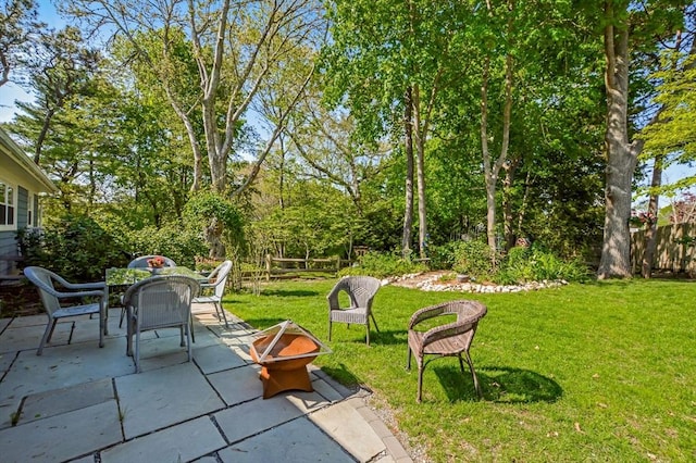 view of patio / terrace with an outdoor fire pit and outdoor dining space