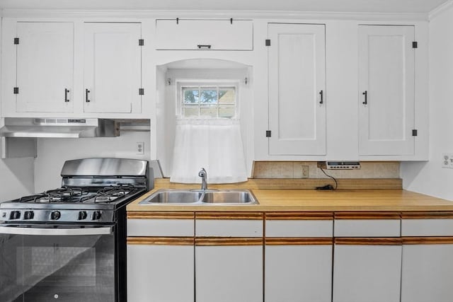 94 Clinton Rd, Weymouth, MA 02189 - kitchen featuring range with gas stovetop, under cabinet range hood, white cabinetry, light countertops, and arched walkways