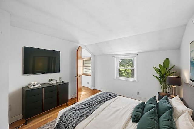 94 Clinton Rd, Weymouth, MA 02189 - bedroom with lofted ceiling and light wood-style floors