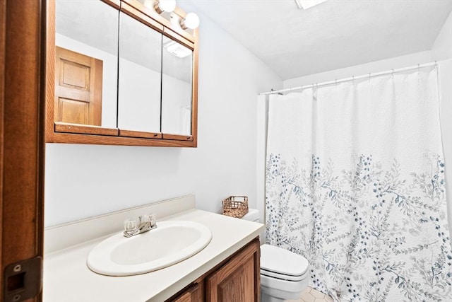 full bath featuring toilet and vanity