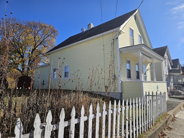 view of property exterior featuring covered porch