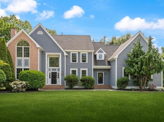 45 Anselm Way, Sudbury, MA 01776 - view of front of house featuring a front lawn and roof with shingles
