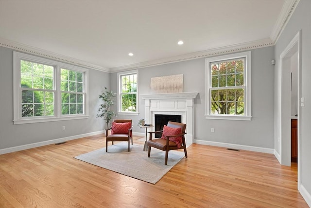 45 Anselm Way, Sudbury, MA 01776 - sitting room featuring ornamental molding, a brick fireplace, light wood-type flooring, baseboards, and recessed lighting