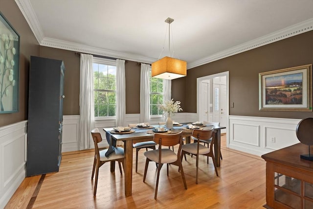 45 Anselm Way, Sudbury, MA 01776 - dining room with light wood-type flooring, crown molding, a wainscoted wall, and a decorative wall