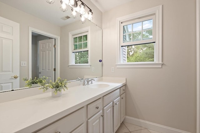45 Anselm Way, Sudbury, MA 01776 - bathroom with vanity, healthy amount of natural light, baseboards, and tile patterned flooring