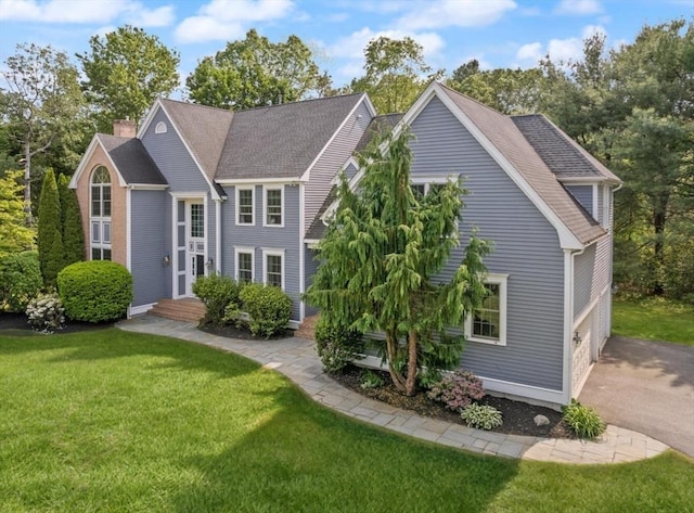 45 Anselm Way, Sudbury, MA 01776 - view of front of house featuring a front yard and a shingled roof