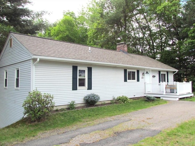 471 Mechanic St, Fitchburg, MA 01420 - single story home featuring a chimney, a wooden deck, and a shingled roof