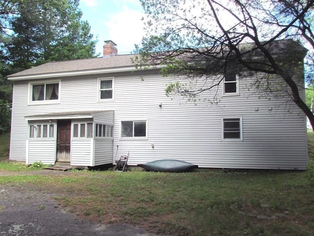 471 Mechanic St, Fitchburg, MA 01420 - rear view of house with a chimney and a lawn