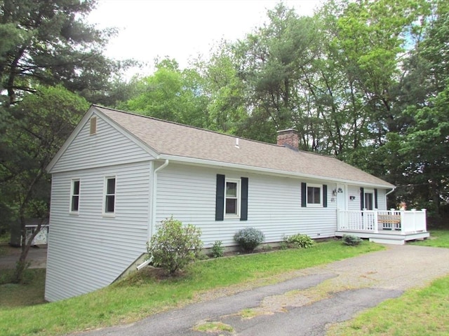 471 Mechanic St, Fitchburg, MA 01420 - ranch-style home featuring a chimney, a shingled roof, and a wooden deck