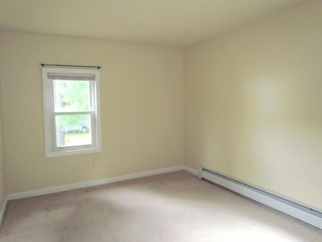 471 Mechanic St, Fitchburg, MA 01420 - empty room featuring a baseboard radiator, light colored carpet, and baseboards