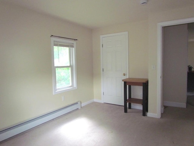 471 Mechanic St, Fitchburg, MA 01420 - unfurnished bedroom with a baseboard heating unit, light carpet, and baseboards