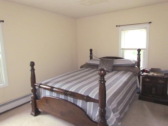 471 Mechanic St, Fitchburg, MA 01420 - carpeted bedroom with a baseboard heating unit