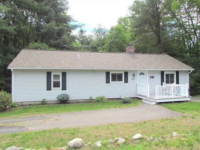 471 Mechanic St, Fitchburg, MA 01420 - ranch-style home featuring a chimney, roof with shingles, view of scattered trees, and a deck