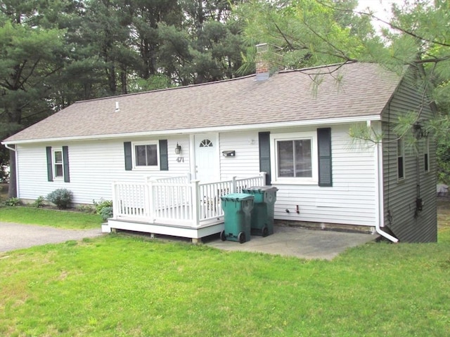 471 Mechanic St, Fitchburg, MA 01420 - view of front of property featuring a shingled roof, a wooden deck, a front yard, a chimney, and a patio