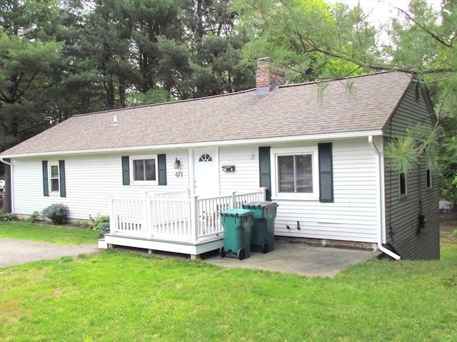 471 Mechanic St, Fitchburg, MA 01420 - single story home with a chimney, a wooden deck, a shingled roof, a front yard, and a patio area