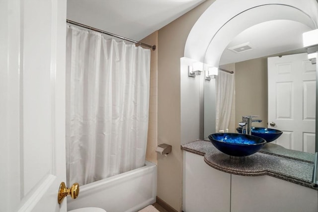 5 Brigham St Unit 1, Boston, MA 02128 - bathroom featuring vanity, shower / bath combo, and toilet