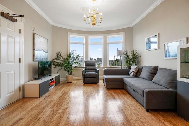 5 Brigham St Unit 1, Boston, MA 02128 - living room featuring healthy amount of natural light, a chandelier, crown molding, and light wood-style flooring