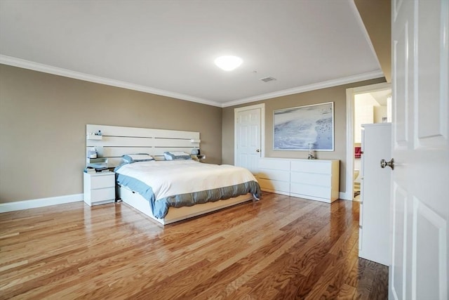 5 Brigham St Unit 1, Boston, MA 02128 - bedroom featuring ornamental molding, wood finished floors, and baseboards