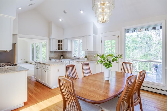 18 Curve Hill Rd, Yarmouth, MA 02664 - dining room featuring light wood-style floors, baseboard heating, a chandelier, high vaulted ceiling, and recessed lighting