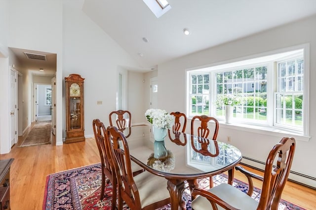 18 Curve Hill Rd, Yarmouth, MA 02664 - dining room with a skylight, high vaulted ceiling, and light wood finished floors