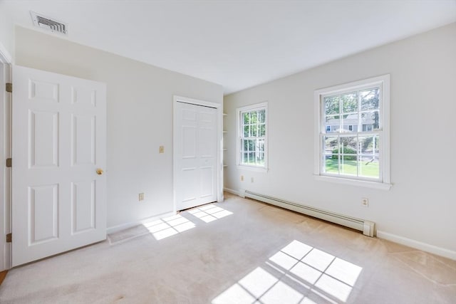 18 Curve Hill Rd, Yarmouth, MA 02664 - unfurnished bedroom with a baseboard heating unit, carpet flooring, and baseboards