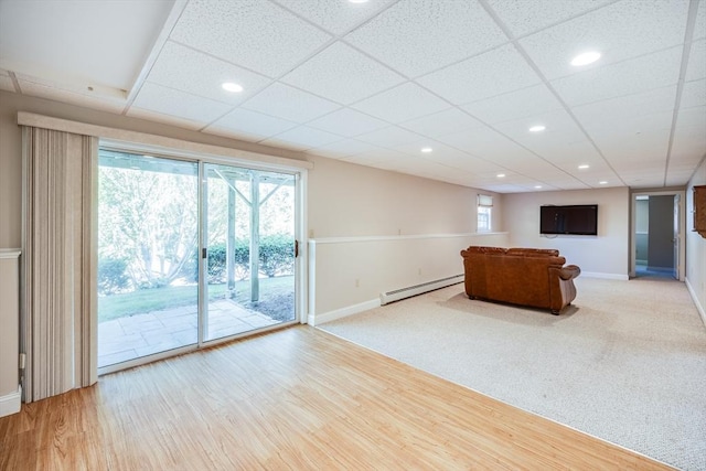 18 Curve Hill Rd, Yarmouth, MA 02664 - living room featuring a baseboard heating unit, baseboards, recessed lighting, and wood finished floors