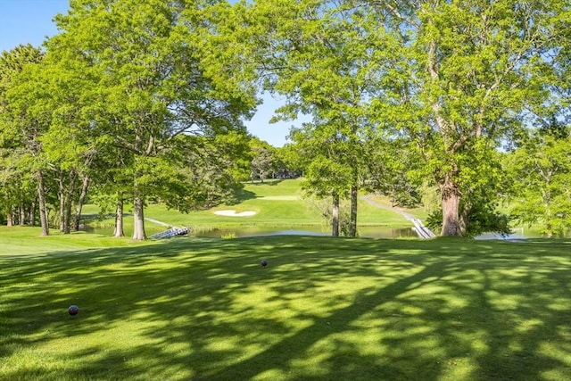 18 Curve Hill Rd, Yarmouth, MA 02664 - view of home's community with view of wooded area, a yard, and a water view