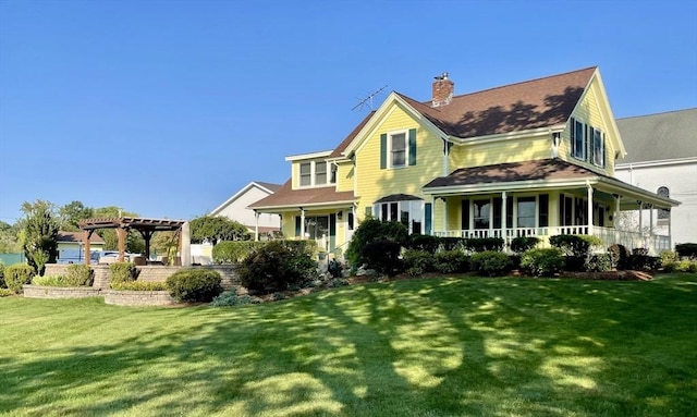 view of front facade featuring covered porch, a pergola, and a front yard