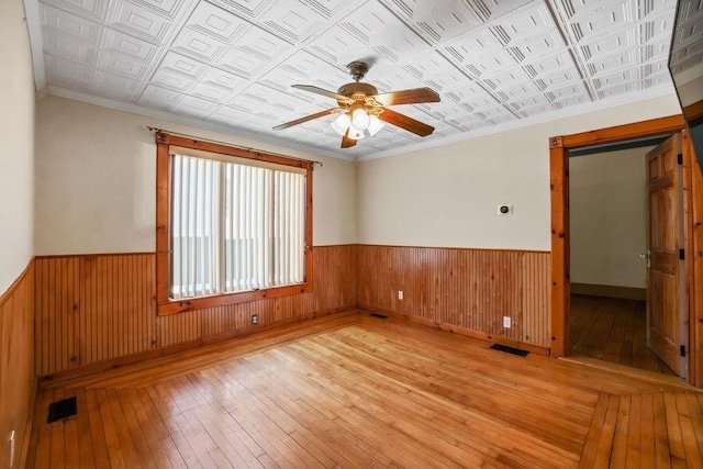 spare room with ceiling fan and light hardwood / wood-style flooring