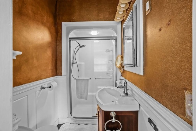 bathroom with vanity and a shower with shower door