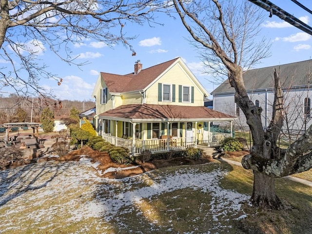 back of house with a porch